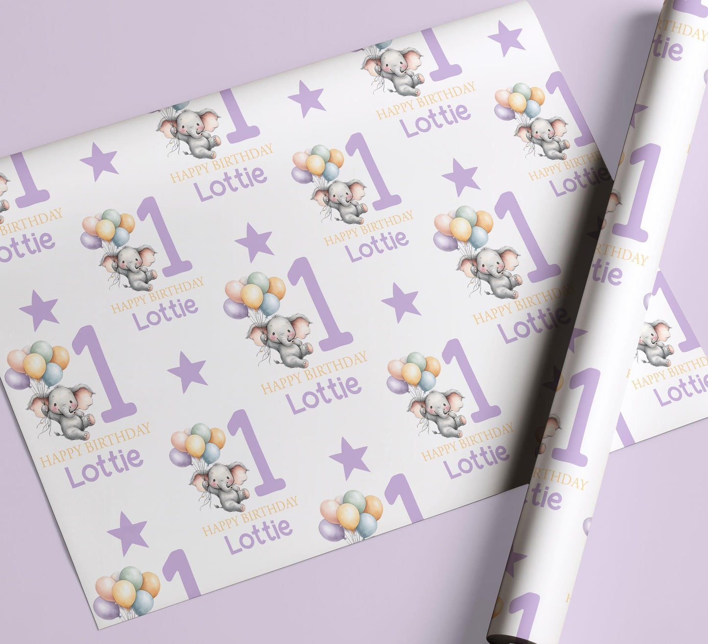Personalised purple elephant birthday wrapping paper wrapped around a gift box, ready to give.