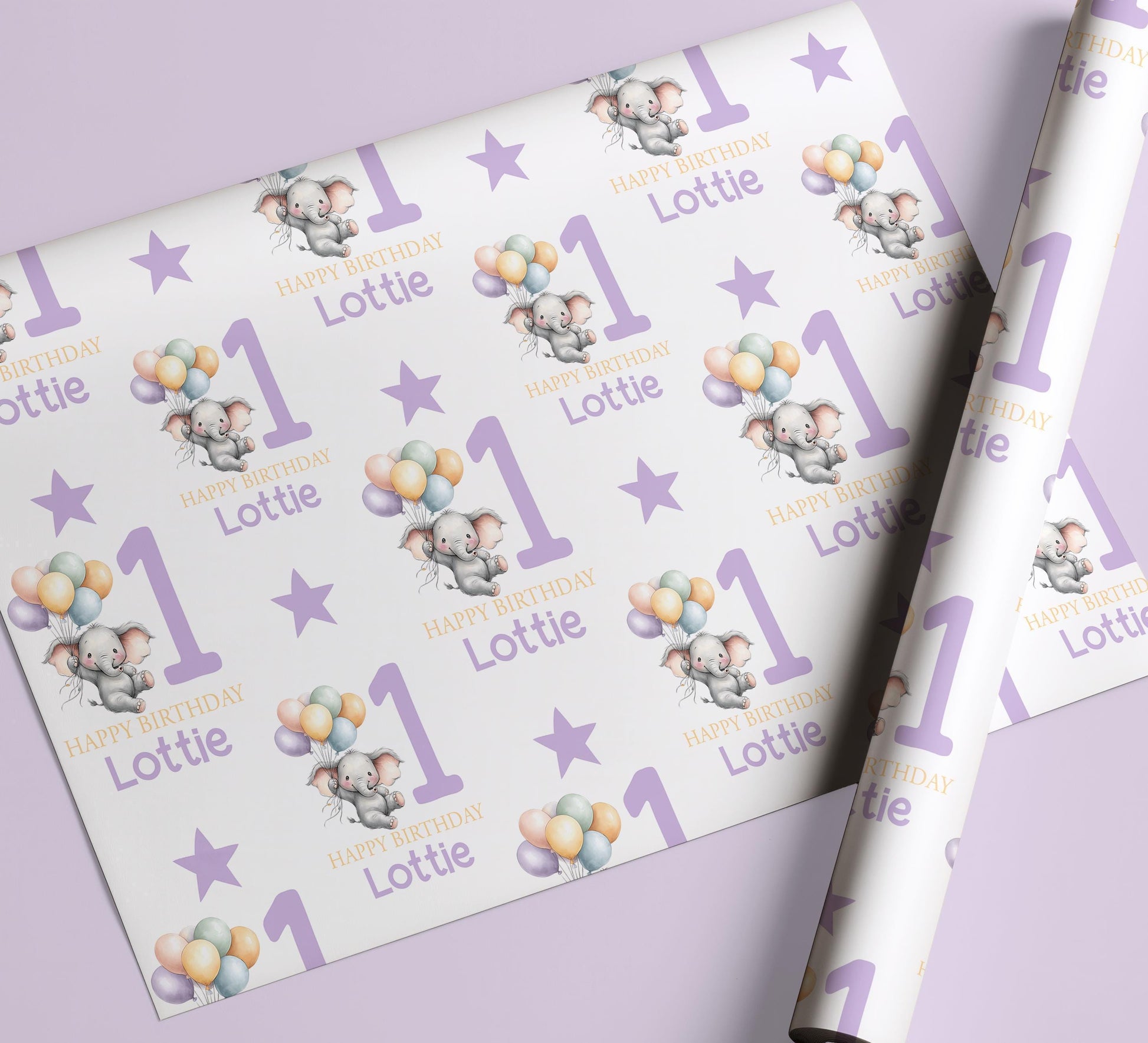 Personalised purple elephant birthday wrapping paper wrapped around a gift box, ready to give.