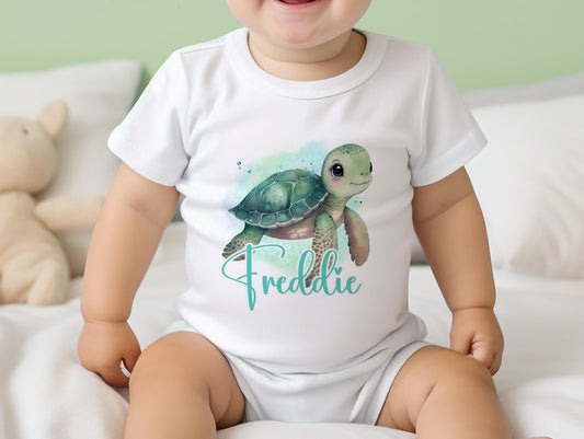 Personalised sea turtle design baby bib, printed with baby's name on soft cotton.
