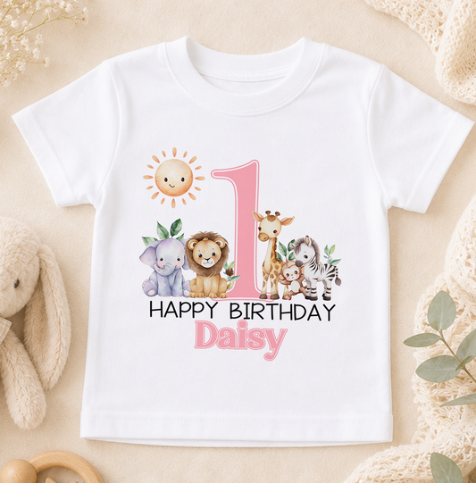 A white t-shirt with a graphic design featuring a sun, a giraffe, an elephant, and a lion, along with the text "Happy Birthday Daisy" printed on it.