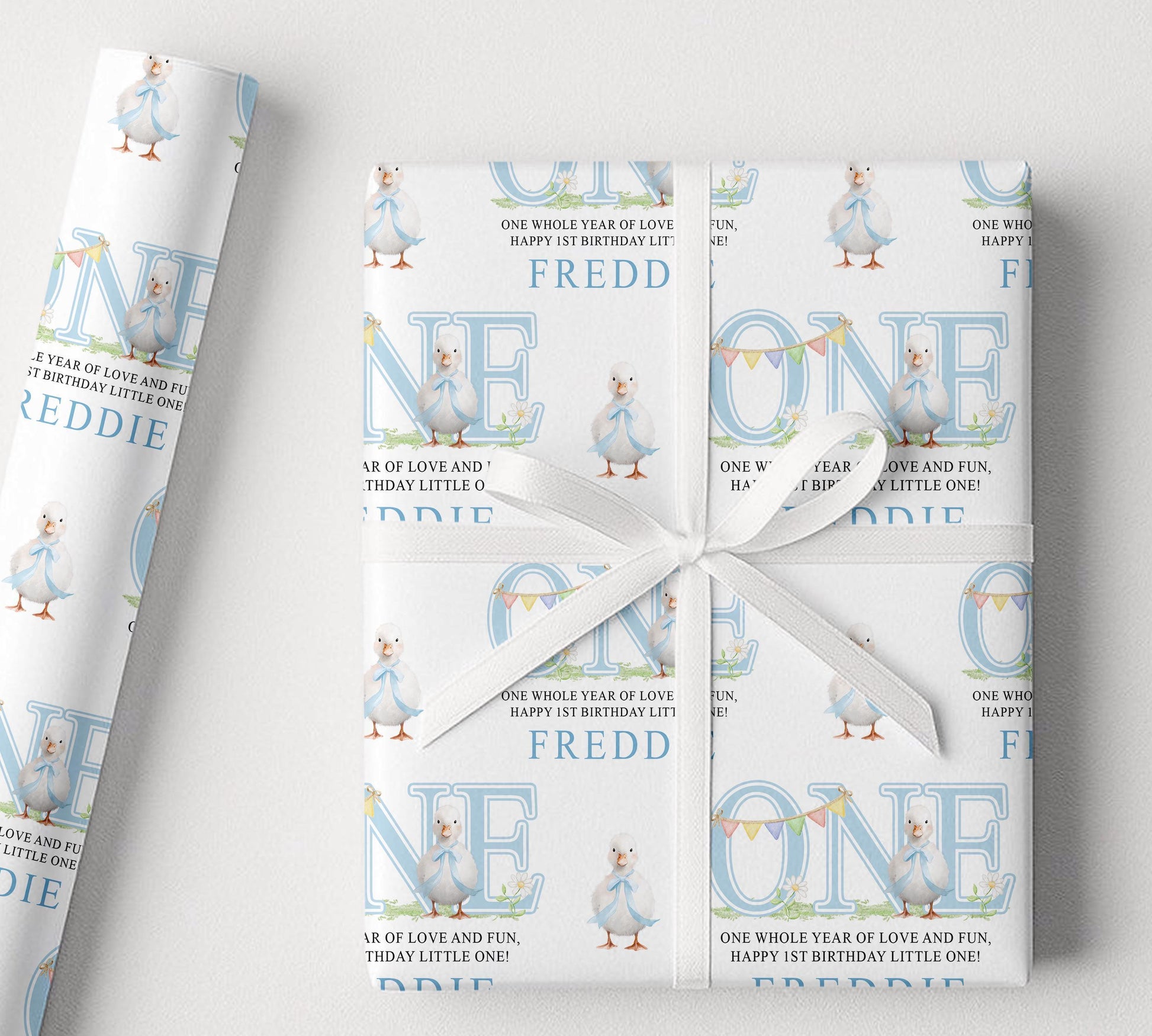 Personalised blue duck 1st birthday wrapping paper rolled and packaged for delivery