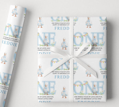 Personalised blue duck 1st birthday wrapping paper rolled and packaged for delivery