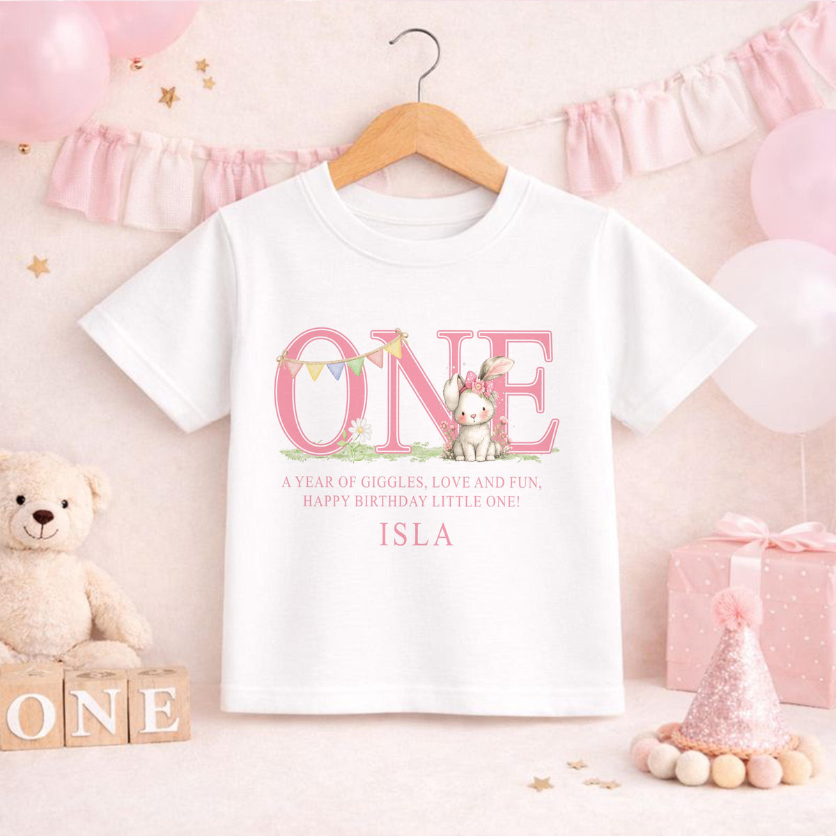 Personalised first birthday sleepsuit with pink bunny design and custom name print