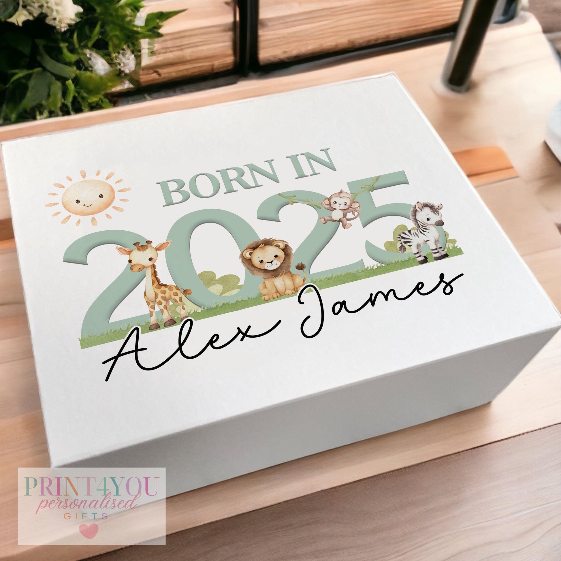 White magnetic keepsake box in a sage green safari design, personalised with a baby's name for a 2025 first birthday
