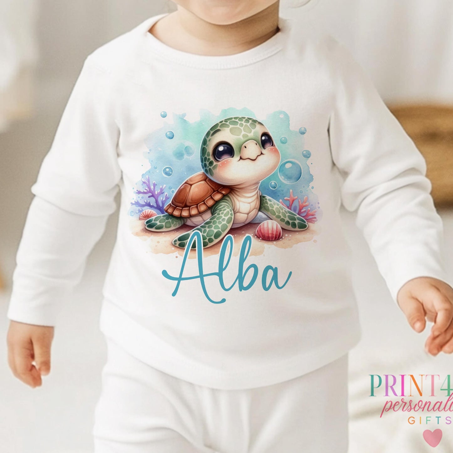 Personalised Sea Turtle sleepsuit for newborns, printed with baby's name.
