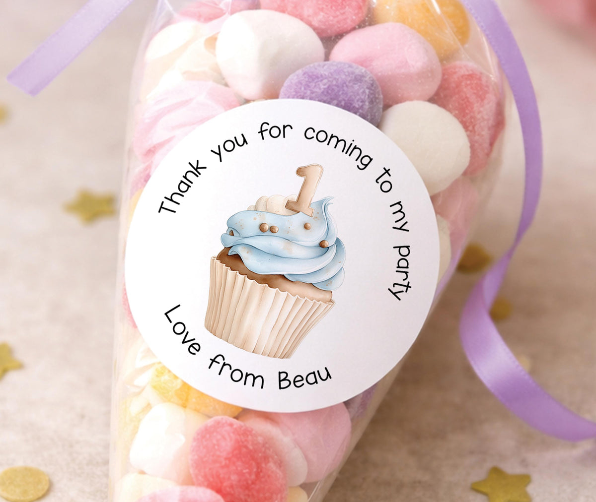 Sheet of glossy round stickers featuring a blue cupcake design, personalised for a first birthday party bag or favour tag