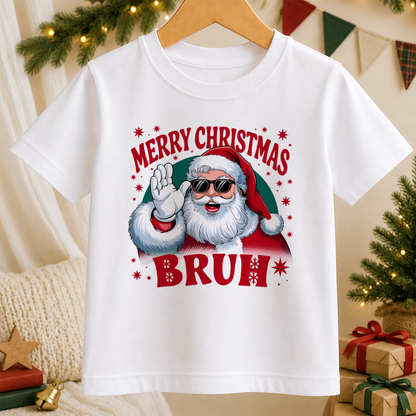 A white t-shirt with a graphic design featuring a smiling Santa Claus wearing sunglasses and the text "MERRY CHRISTMAS BRUH"