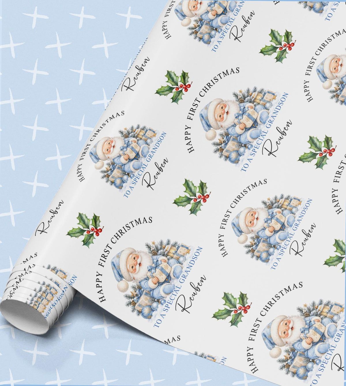 Personalised baby's first Christmas wrapping paper in pale blue with Santa in a blue suit, a frosted tree, presents and holly, relation and name