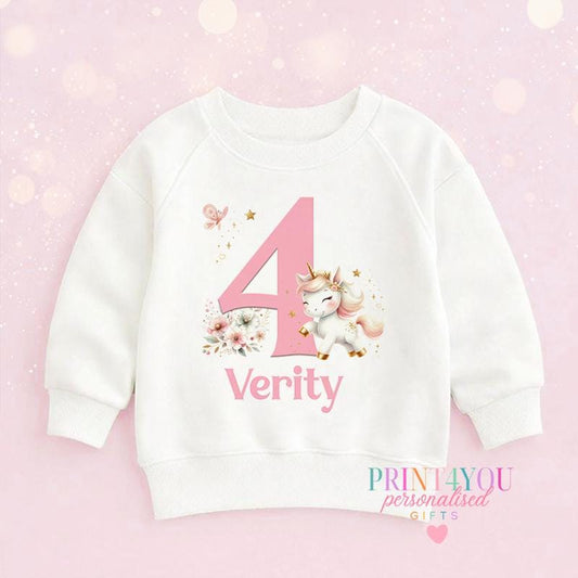 White cotton children's sweatshirt personalised with a unicorn design, a child's name and birthday number.