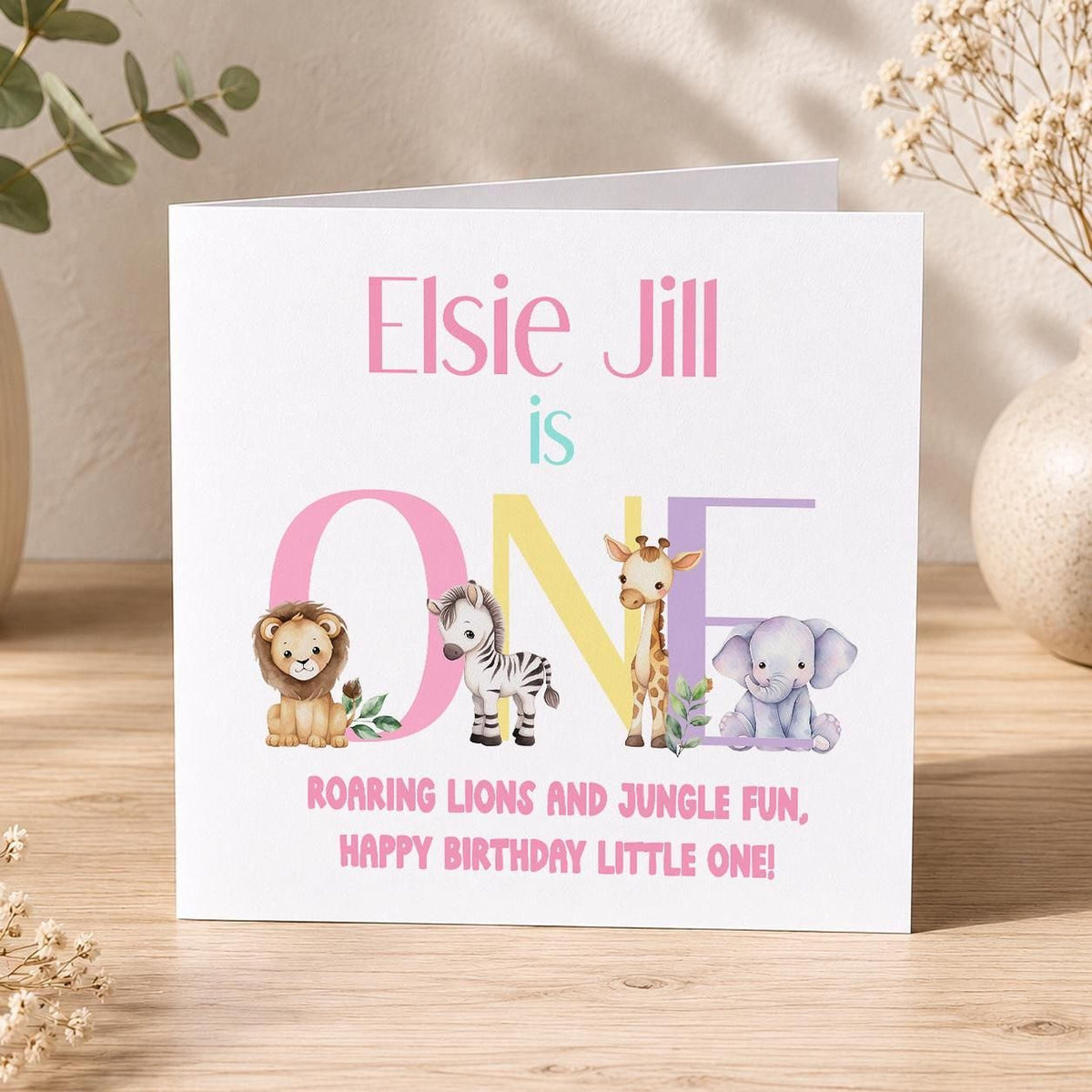 Front view of the personalised safari jungle animals birthday card on a plain background.