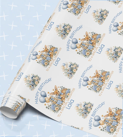 Personalised birthday wrapping paper in blue with a baby deer, balloons and flowers, Happy Birthday with a relation and name