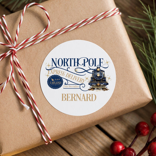 A brown gift box with a white label that reads "NORTHPOPL[E]L[A]D[L]Y" and "EXPRESS DELIVERY" along with a train image. The label also includes the name "BERNARD" and the date "25th Dec".