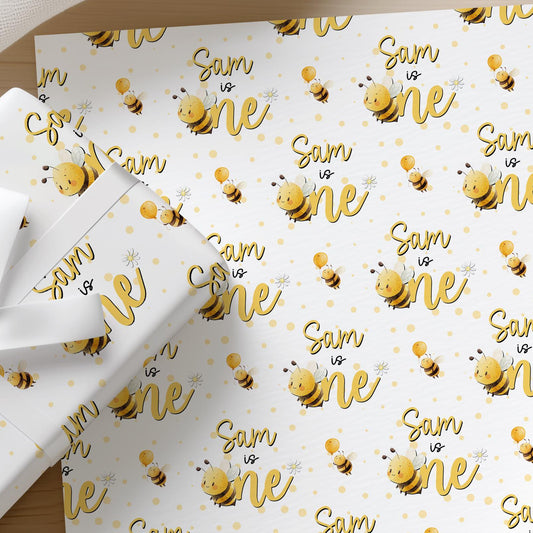 Printed bee birthday wrapping paper shown as wrapping paper