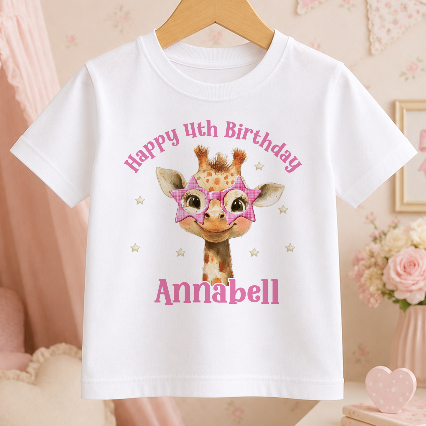 A white t-shirt with a giraffe wearing sunglasses and a birthday message printed on it.