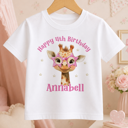 A white t-shirt with a giraffe wearing sunglasses and a birthday message printed on it.