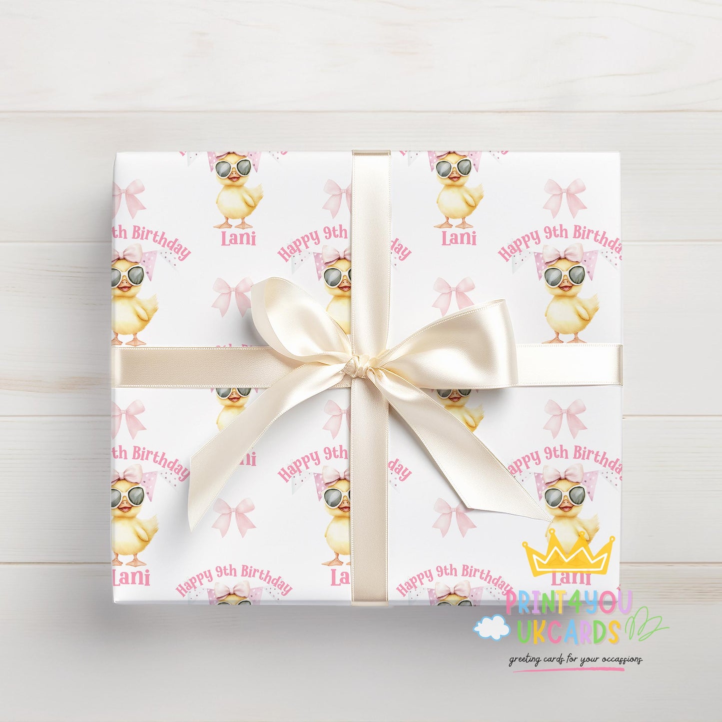 Personalised duck birthday wrapping paper wrapped around a gift