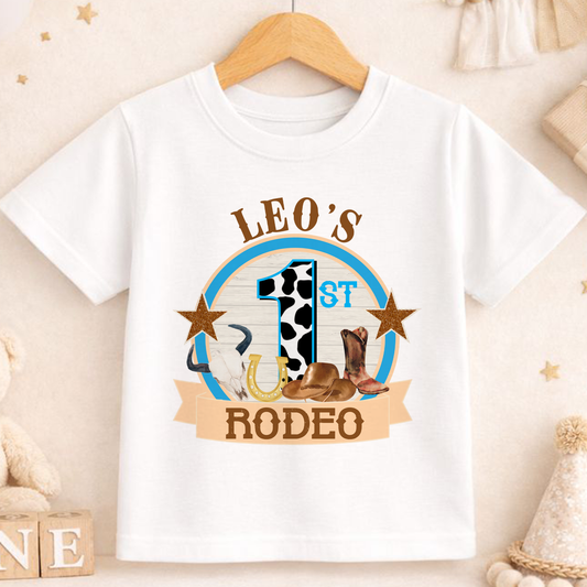 Personalised cowboy rodeo first birthday t-shirt printed with your baby's name, cow and horseshoe design