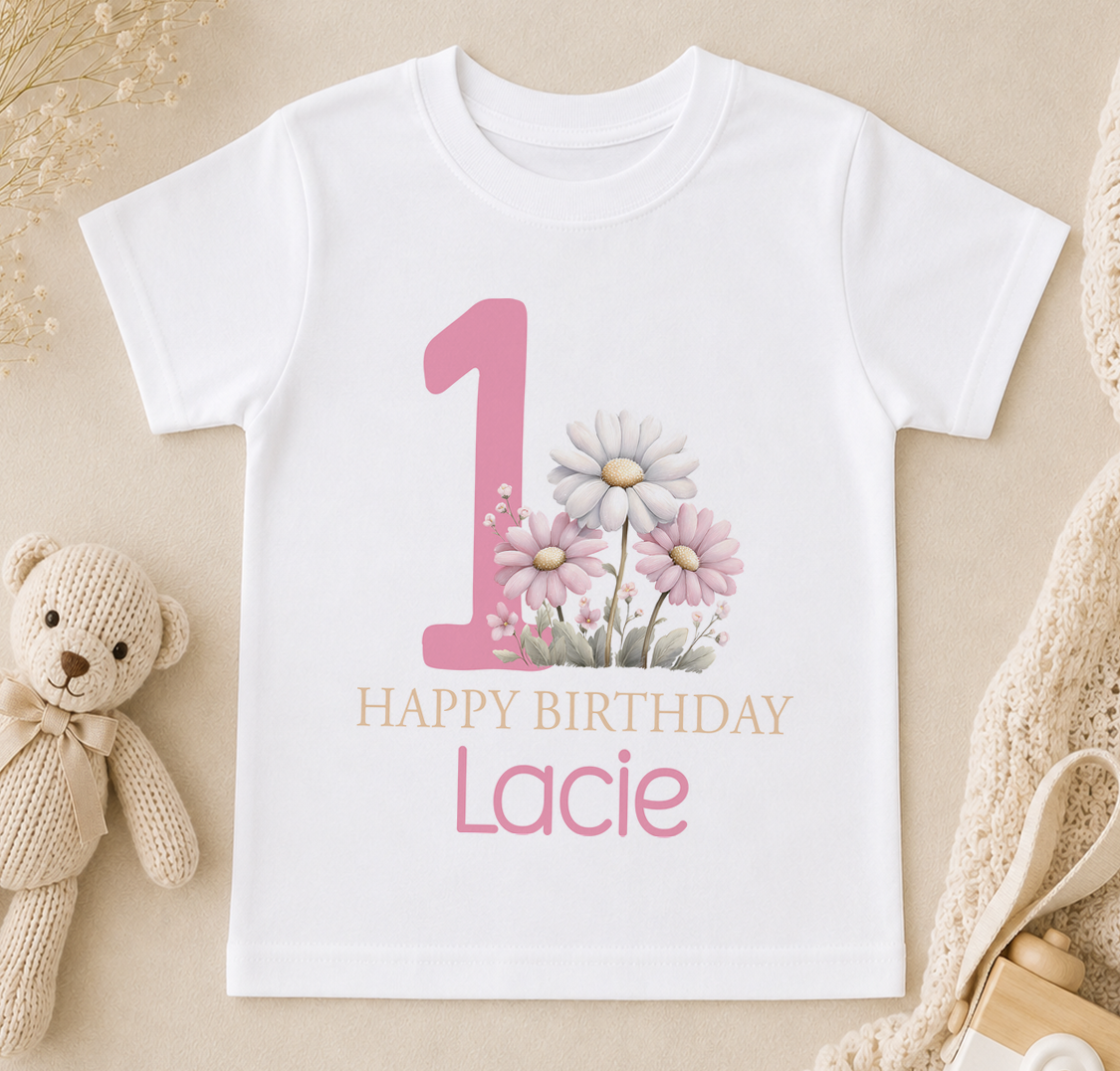 Personalised white t-shirt printed with a pink number one, floral design and 'Happy Birthday' name print for a first birthday