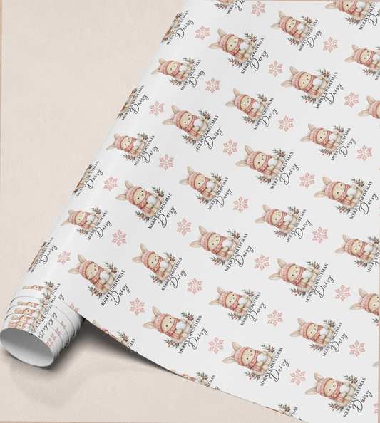 Close-up of the personalised bunny rabbit Christmas gift wrap roll design showing the custom name detail