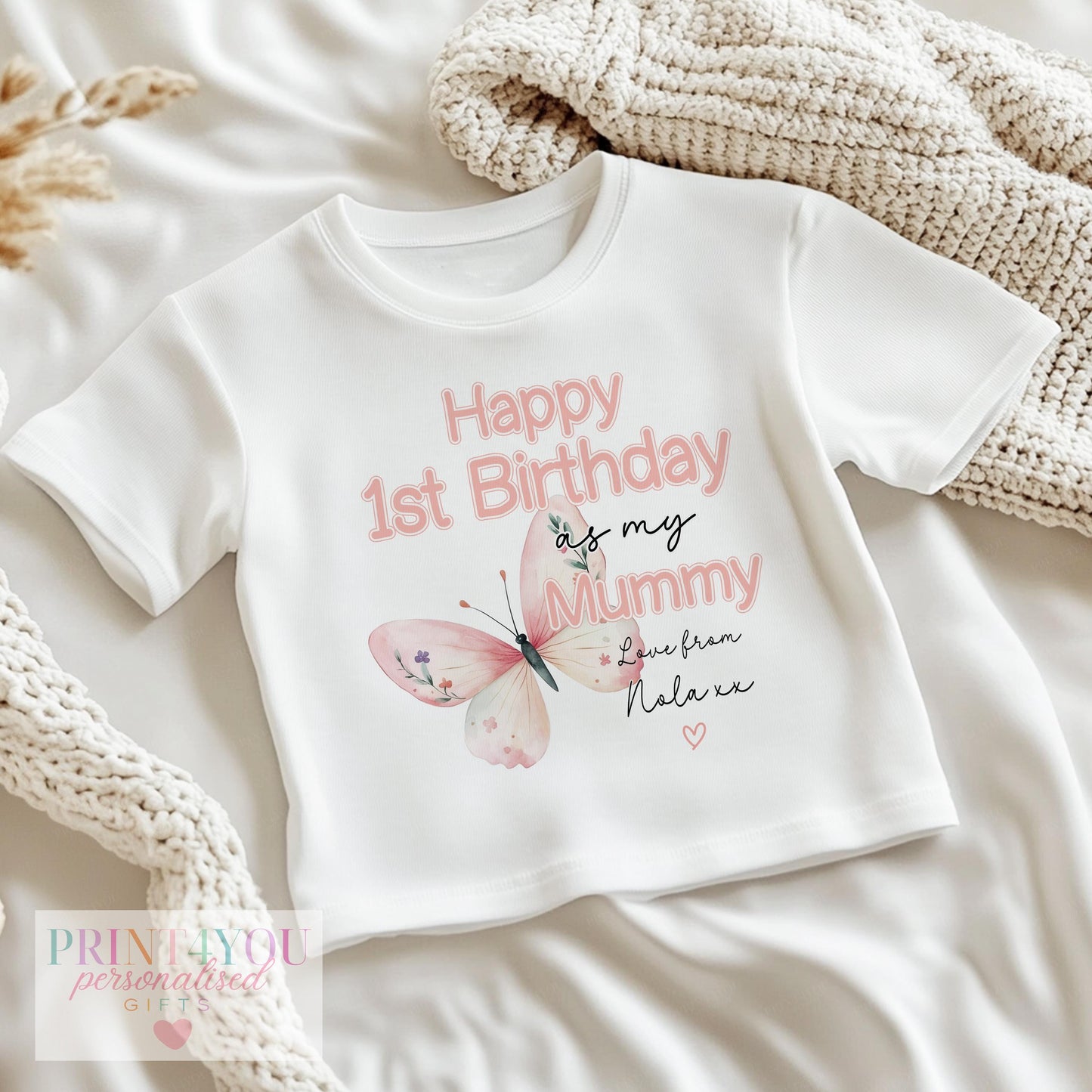 Close-up of the pink butterfly print and 'Happy 1st Birthday as my Mummy' lettering, personalised with baby's name.