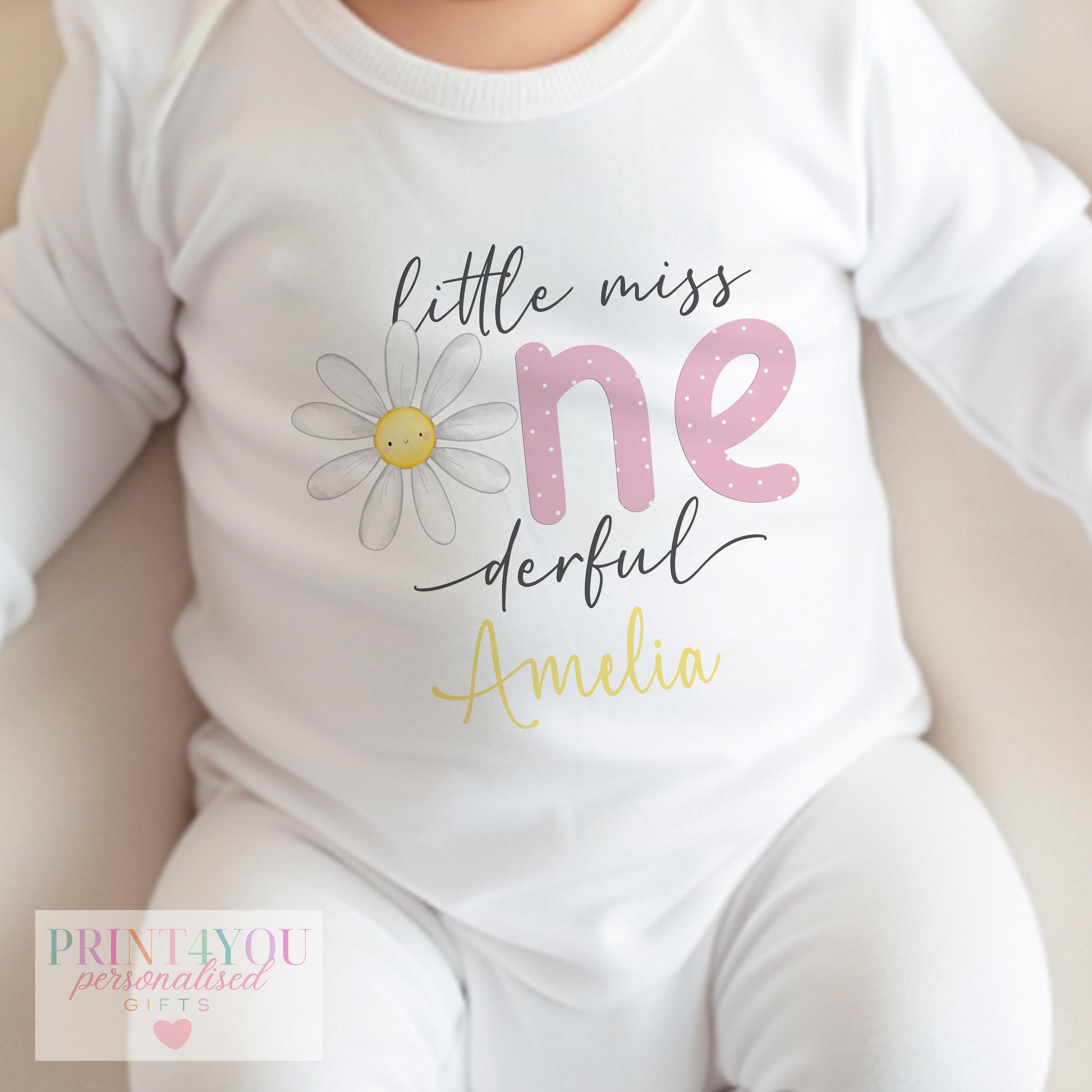 Close-up of the Little Miss One-derful daisy design with the personalised name in golden yellow.