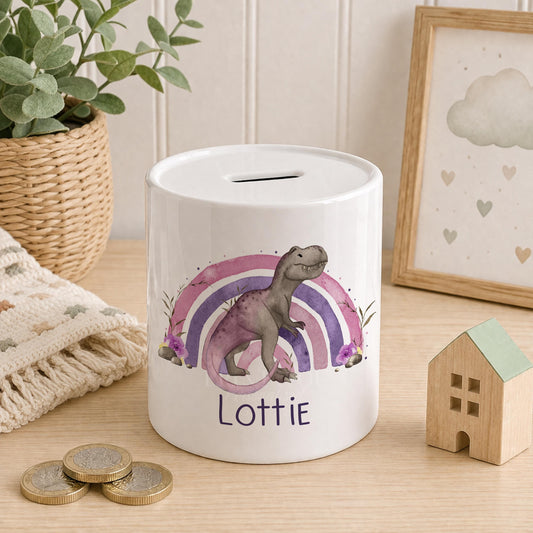 Ceramic money box with a glossy dinosaur design and a removable stopper, personalised with a name