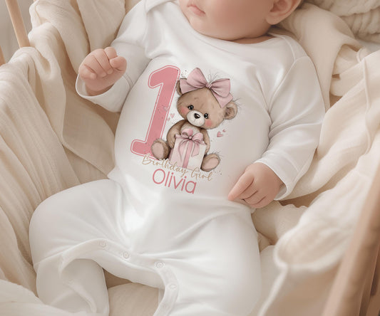 Pink teddy bear design personalised first birthday girl outfit, styled for a cake smash photo shoot.