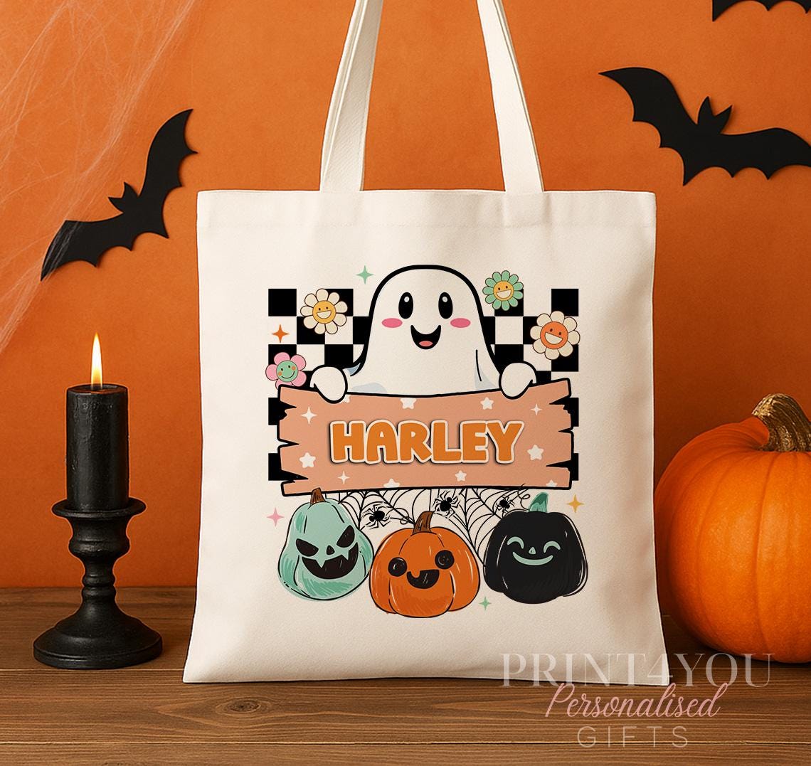 Close-up of the retro ghost and checkerboard print on the personalised Halloween tote bag, showing the custom name banner detail.