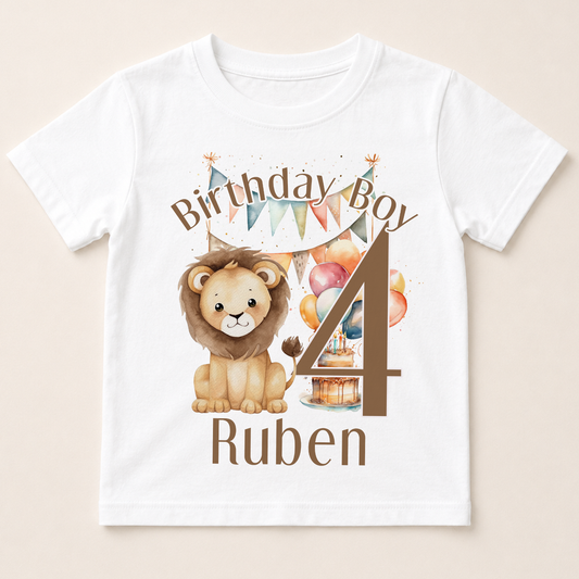 A white t-shirt with a birthday boy design, featuring a lion and balloons, along with the text "Birthday Boy Ruben" and the number "4".