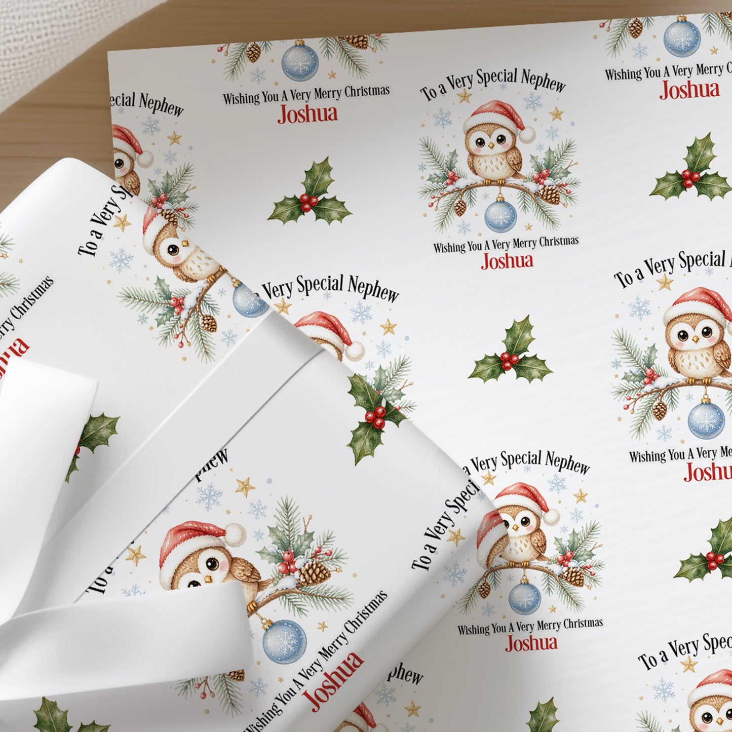 Sheets of the personalised owl Christmas wrapping paper