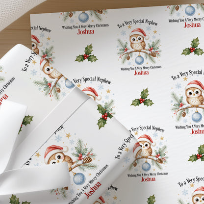 Sheets of the personalised owl Christmas wrapping paper