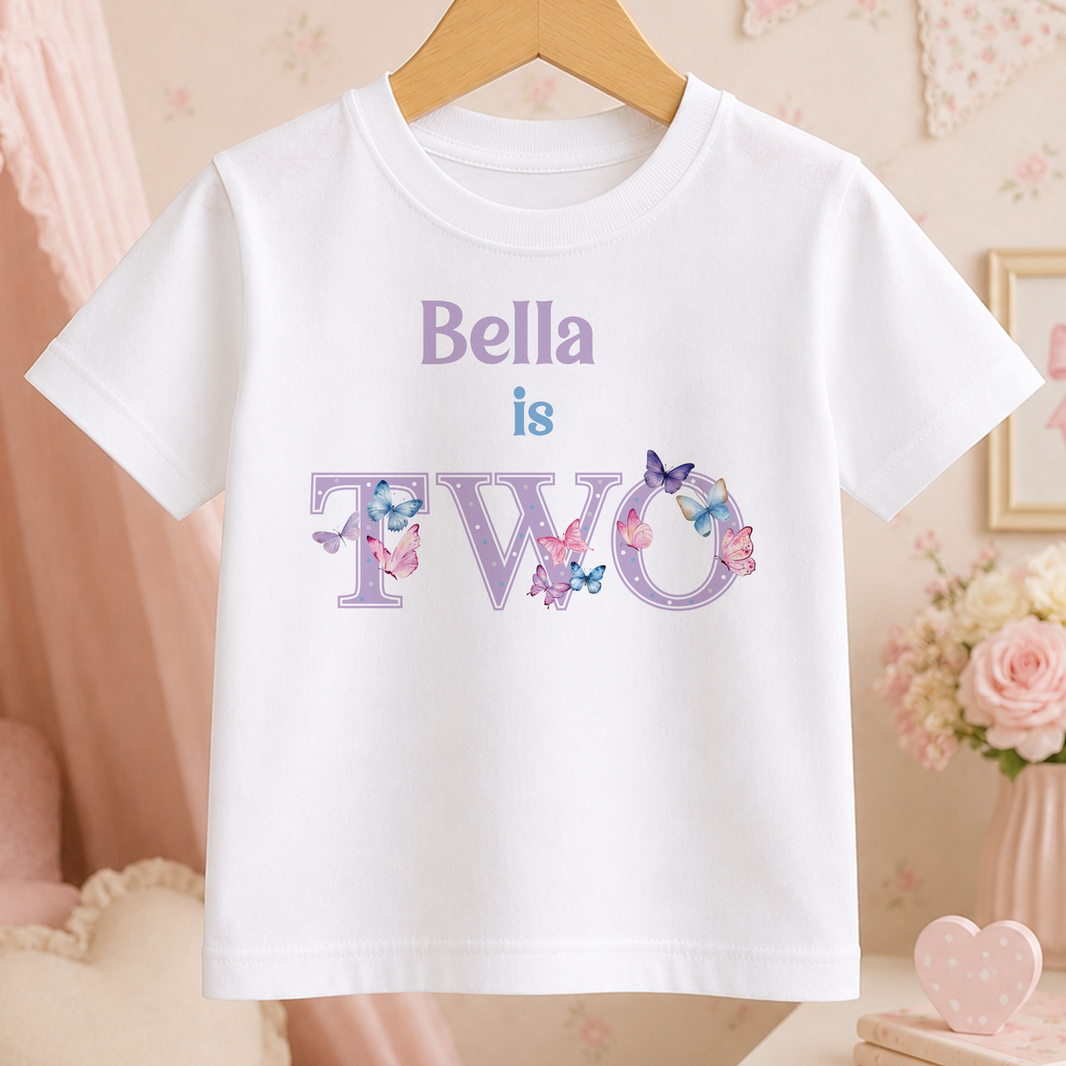 White cotton t-shirt printed with a purple butterfly design and personalised age two wording.