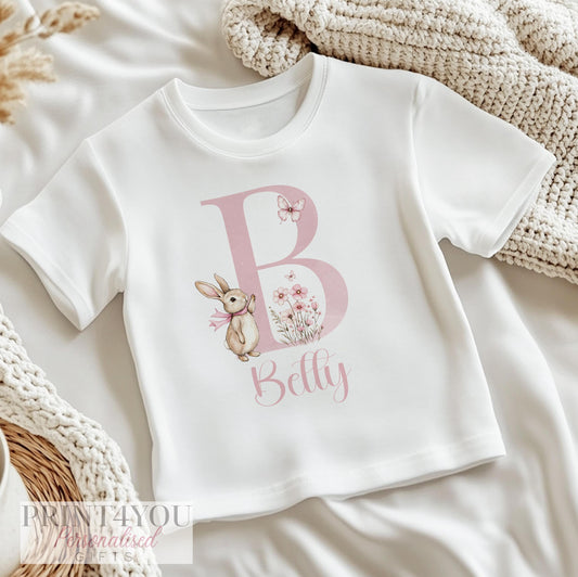 Personalised floral bunny bib, printed with baby's name on soft cotton for a new baby gift.