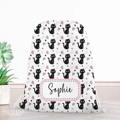 Drawstring PE bag printed with a black cat, pink hearts and butterflies design, personalised with a child's name across the front