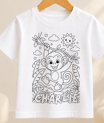 Colour-in kids t-shirt with a black-and-white line art monkey swinging through the jungle, personalised with a name