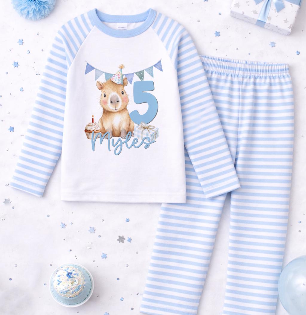 Front view of blue stripe boys birthday pyjama set showing the personalised name print