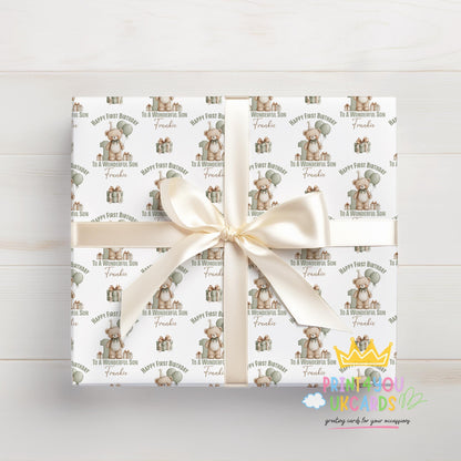Personalised teddy bear first birthday wrapping paper laid flat, showing the full sage green pattern with custom name.