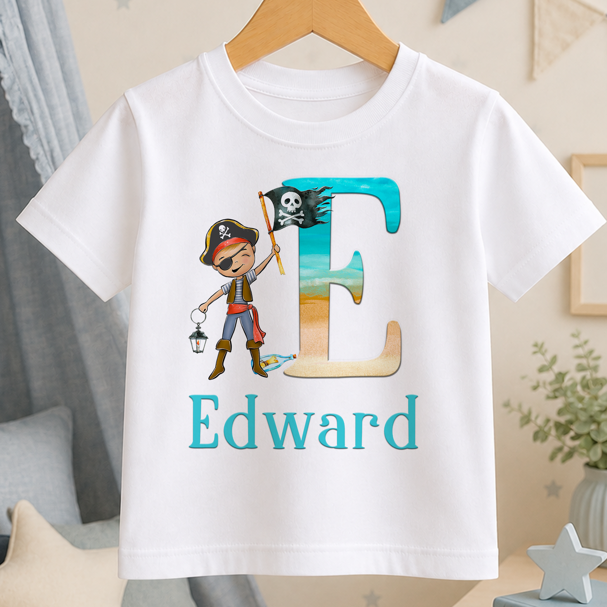 A white t-shirt with a colorful graphic design featuring a pirate character and the name 'Edward'.
