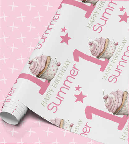 The image is a pink and white wrapping paper with a repeating pattern of cupcakes and stars, along with the text "Happy Summer 1st Birthday".