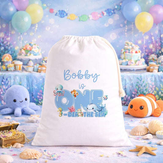 White A3 drawstring party bag printed with an Under the Sea ocean design and personalised child's name.