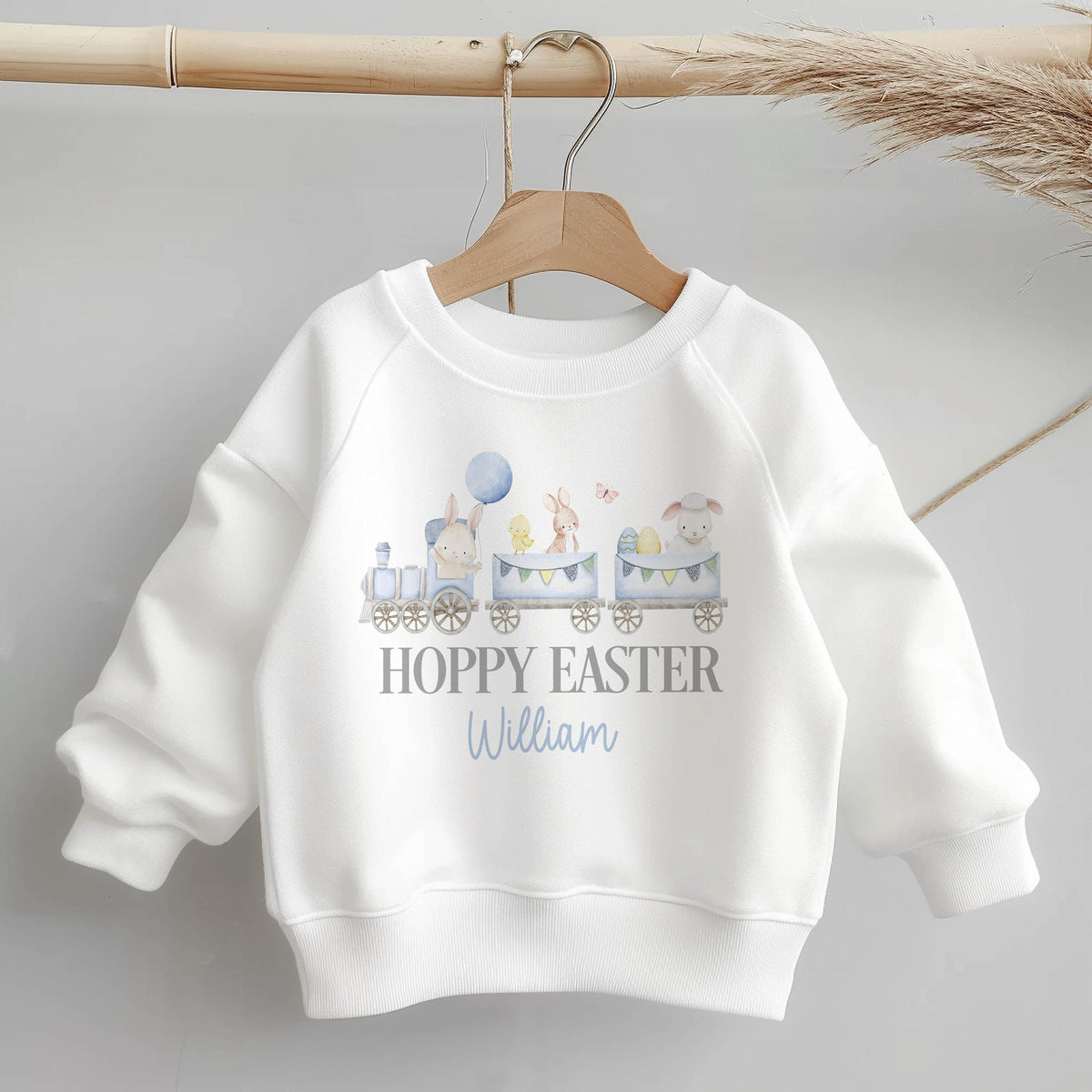 Hoppy Easter train jumper for children, personalised with a name, front view