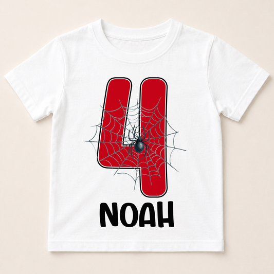 A white t-shirt with a red spider web design and the number 4 printed on it, along with the text "Noah" below the number.