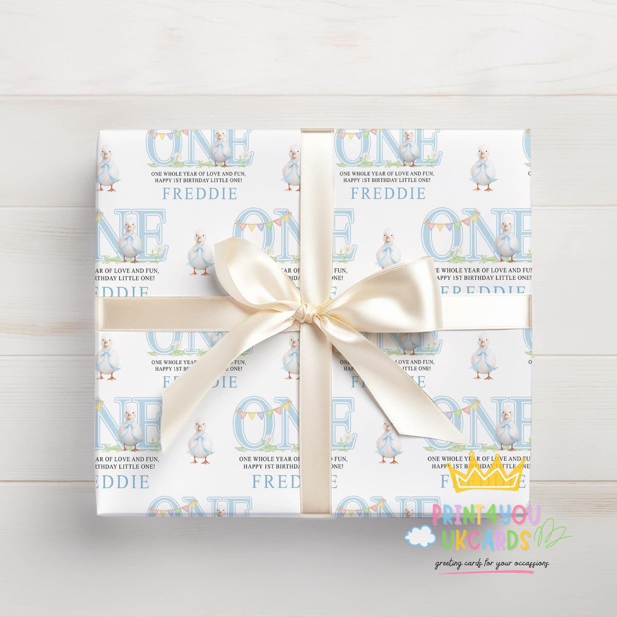 Close-up detail of the blue duck design on personalised 1st birthday wrapping paper