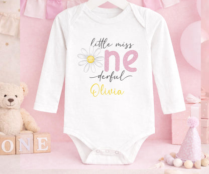 Personalised first birthday long sleeved vest with daisy party design and custom name.