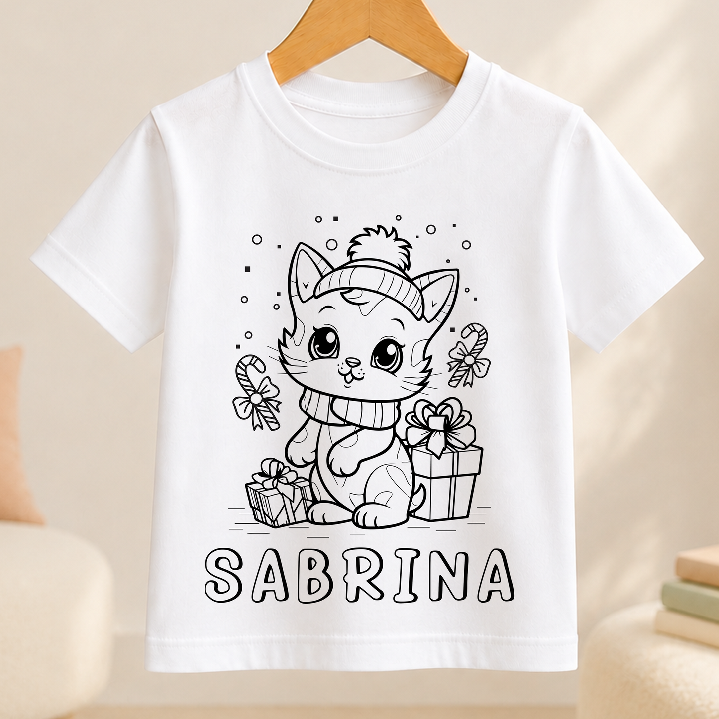 A white t-shirt with a black and white illustration of a cat wearing a hat and holding a gift box, along with the name "SARBRINA" written below the image.