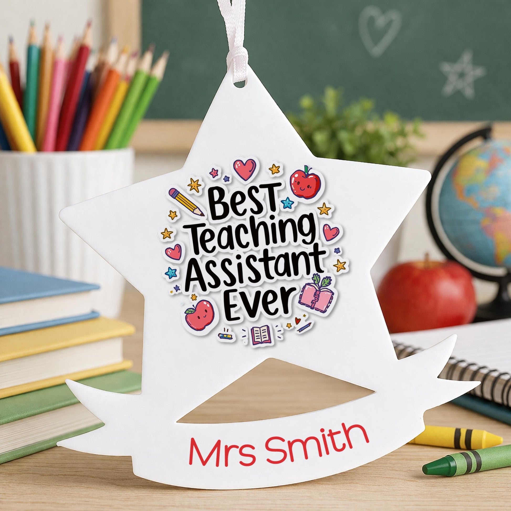 Personalised star-shaped Christmas bauble printed with a name, a Best TA Ever thank you gift for a teaching assistant