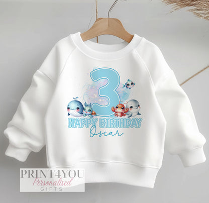 Personalised white sweatshirt for children with blue under the sea animals design, customised with name and birthday number