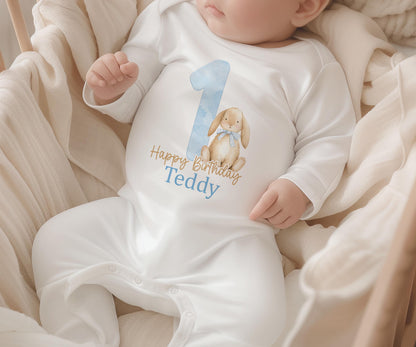 Personalised blue bunny first birthday sleepsuit with custom name print