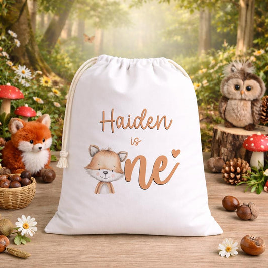 White A3 drawstring party bag printed with a woodland fox design and personalised child's name.