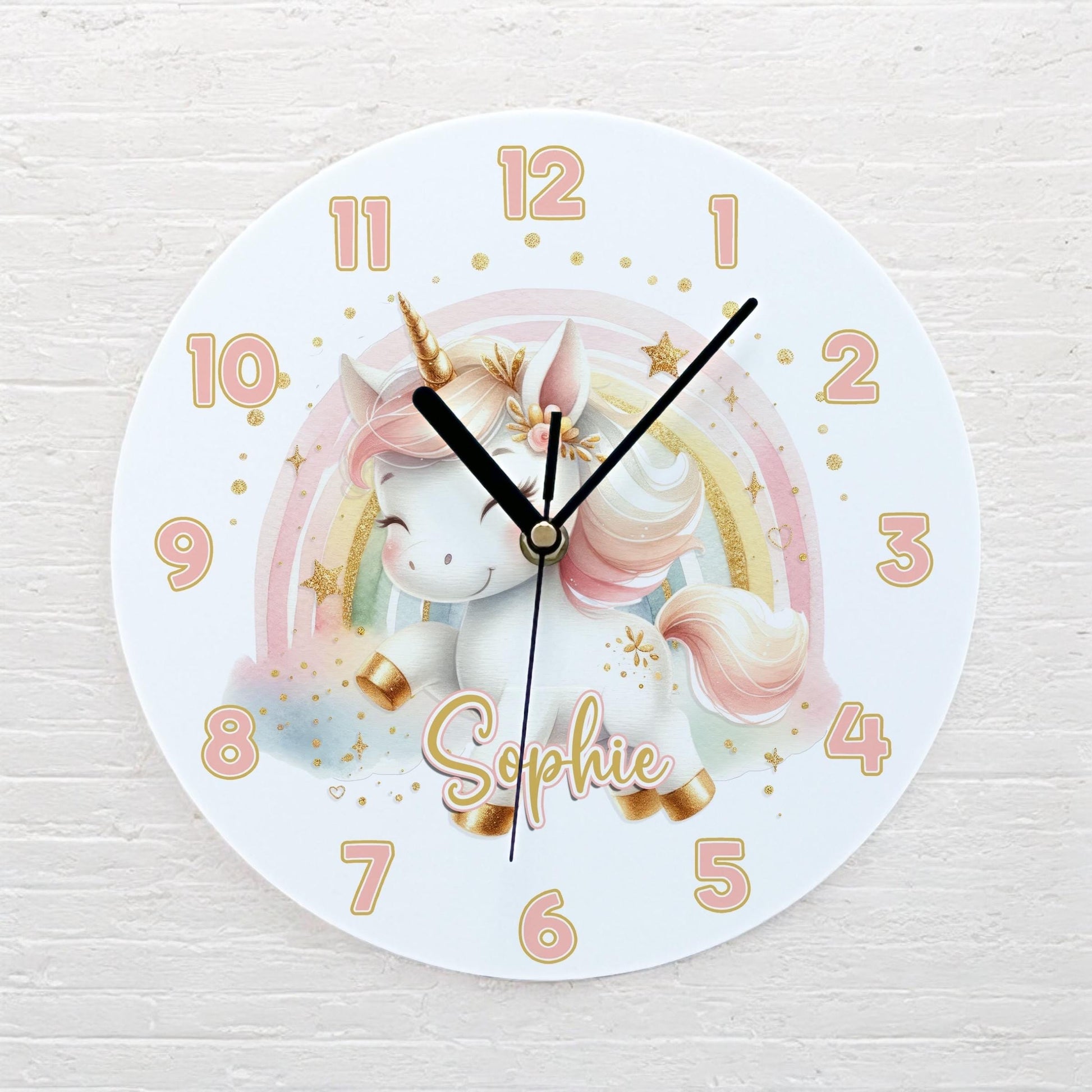Personalised unicorn and rainbow acrylic clock displayed on a child's bedroom wall